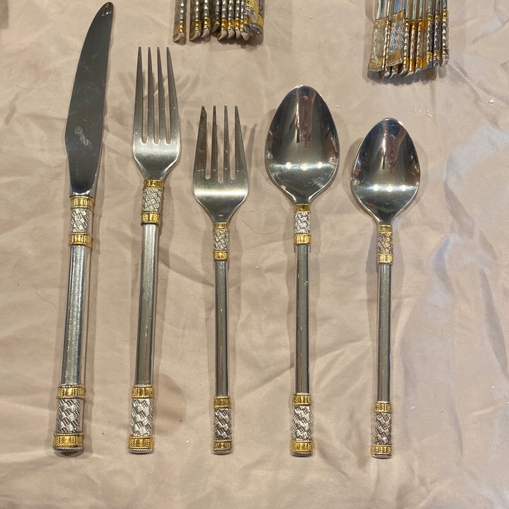 Wallace Aegean weave 50 piece service for 10. Sterling and gold.